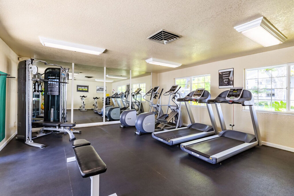 Fitness center with treadmills and ellipticals at Country Brook